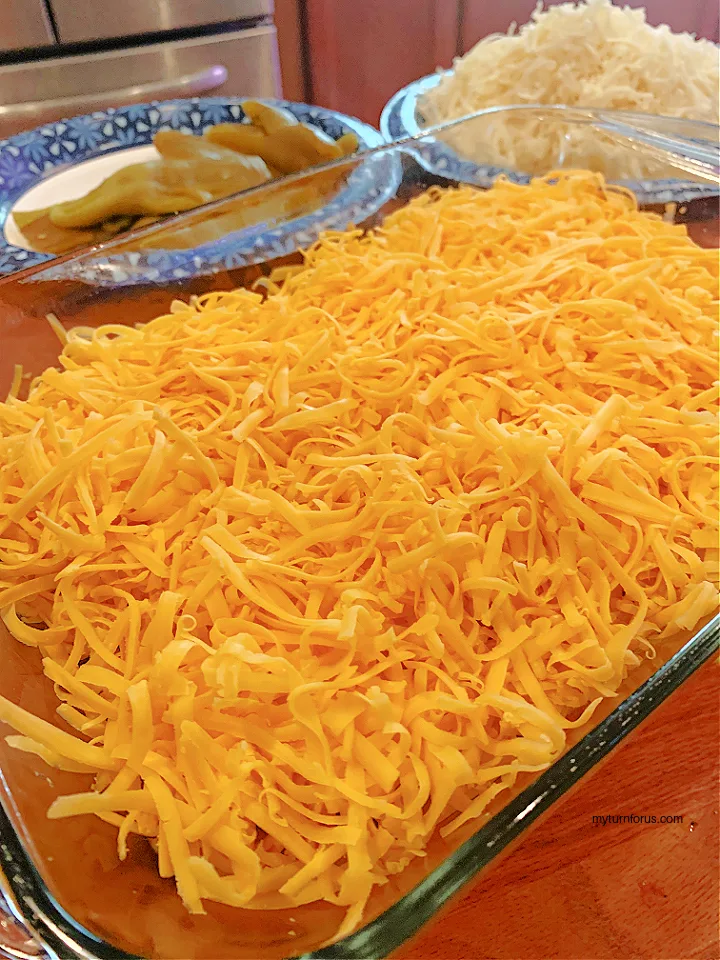 cheddar cheese and green chiles in a baking dish