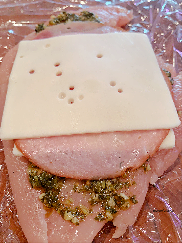 cheese and ham on chicken breast.