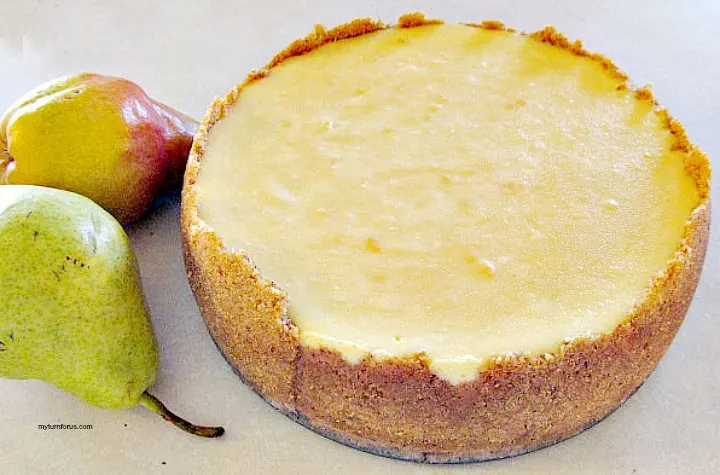 baked cheesecake before adding pear and pecan glaze