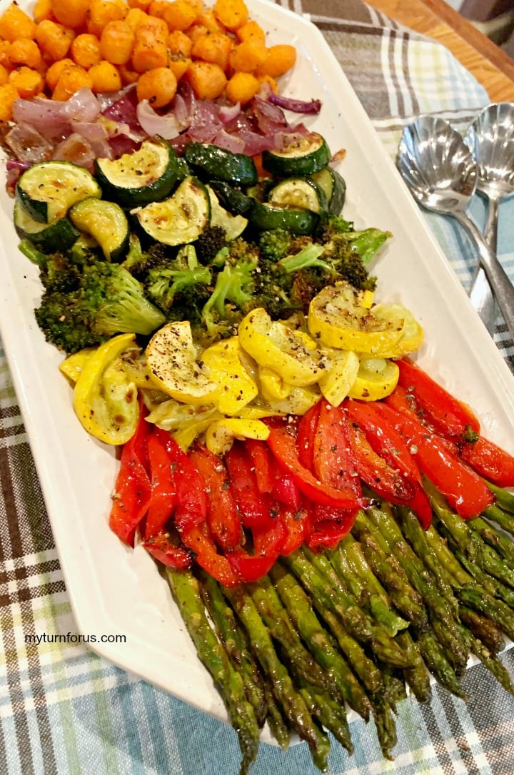 veggies for dinner, rainbow veggie tray filled with roasted carrots, zucchini, broccoli, squash, red bell pepper, asparagus