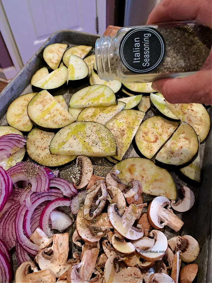 seasoning roasting vegetables with Italian seasoning