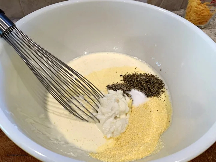 milk, cornmeal, seasonings in a bowl