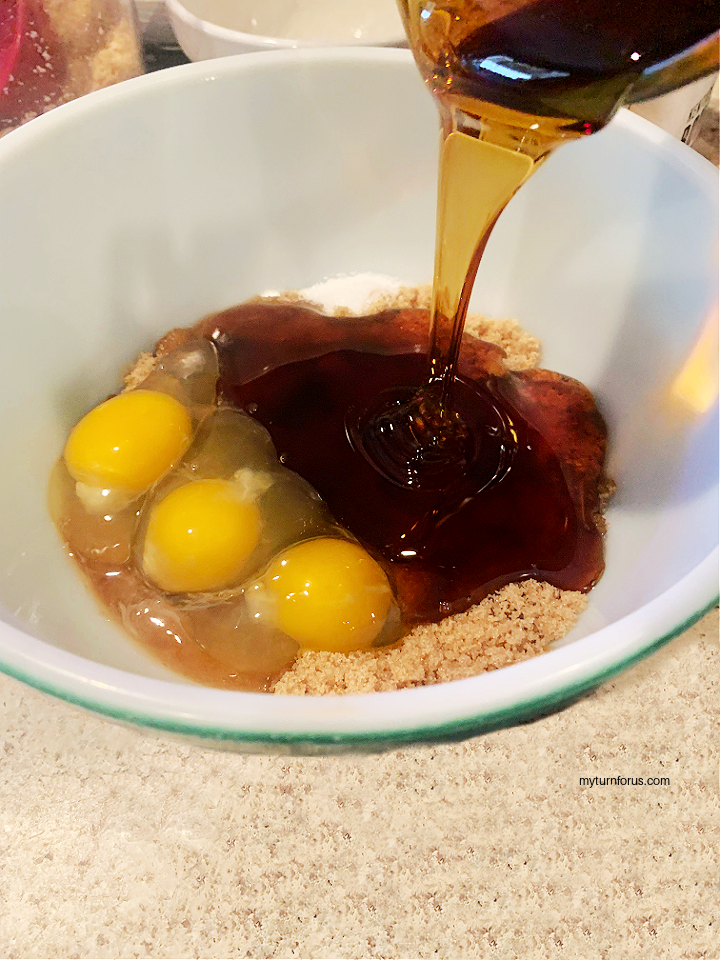 adding syrup to eggs and sugar