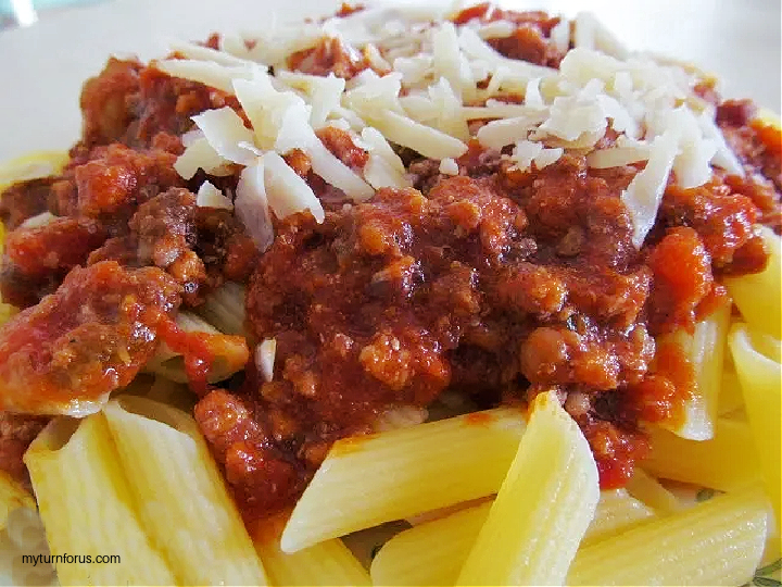 chunky bolognese sauce over penne and topped with parmesan cheese