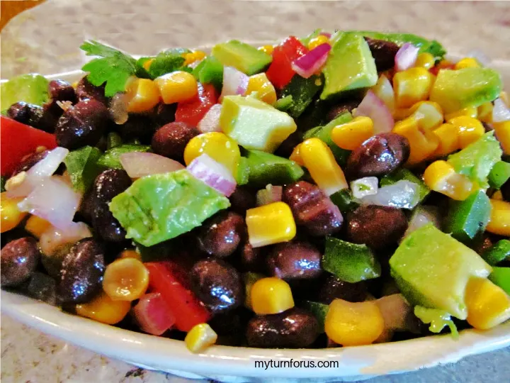 corn, black bean avocado salad with purple onions