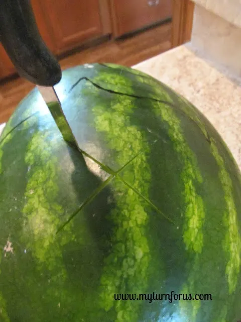 cutting an X on a melon