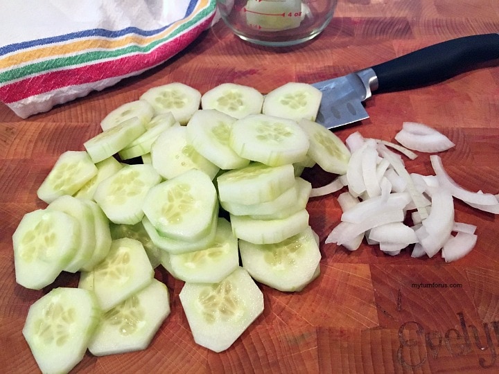 onions cucumber vinegar sugar, sliced cucumbers on a cutting board with onions