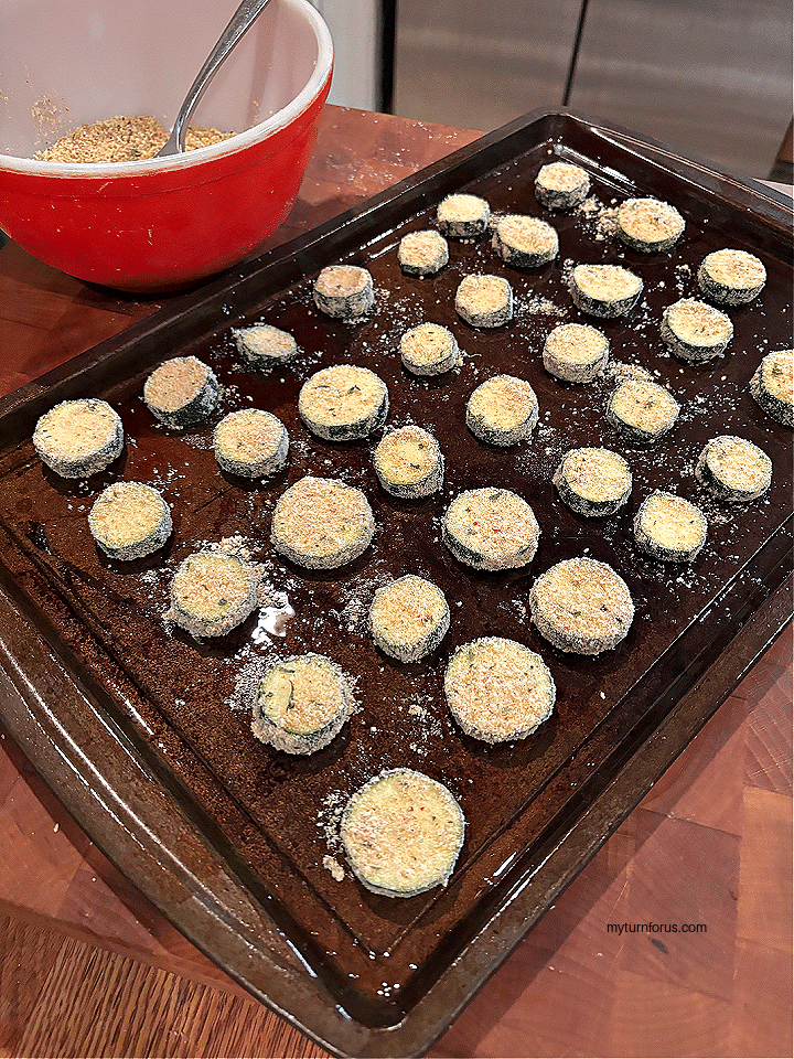 breaded zucchini chips on sheet pan