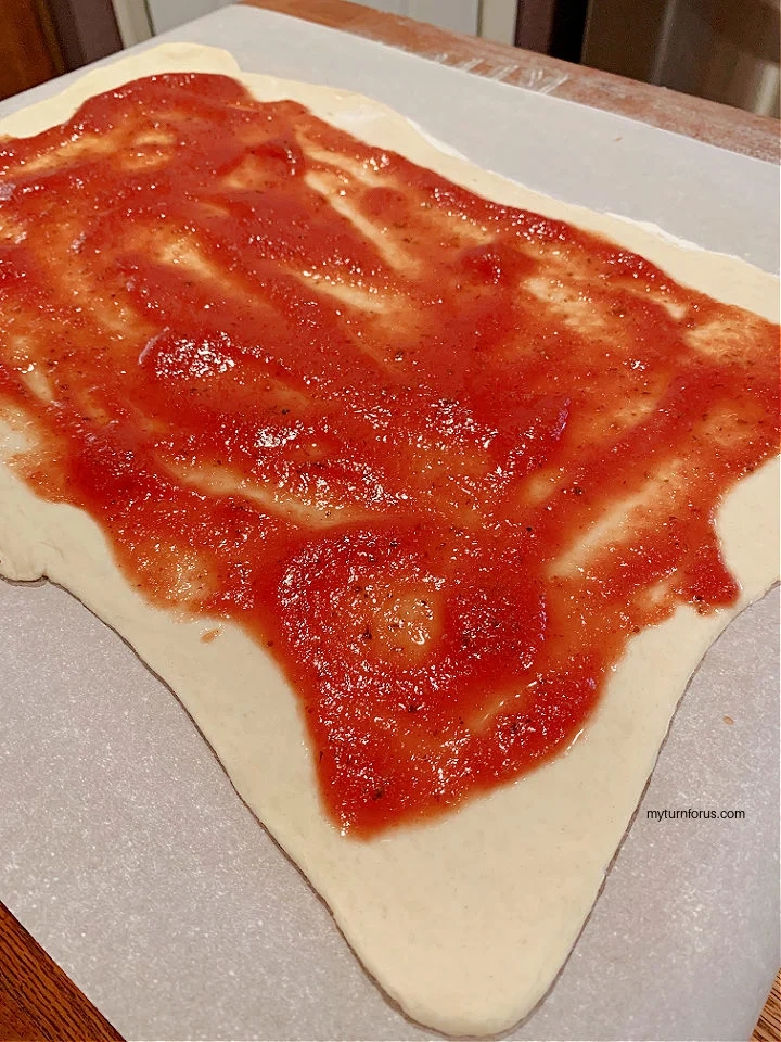 dough with pizza sauce