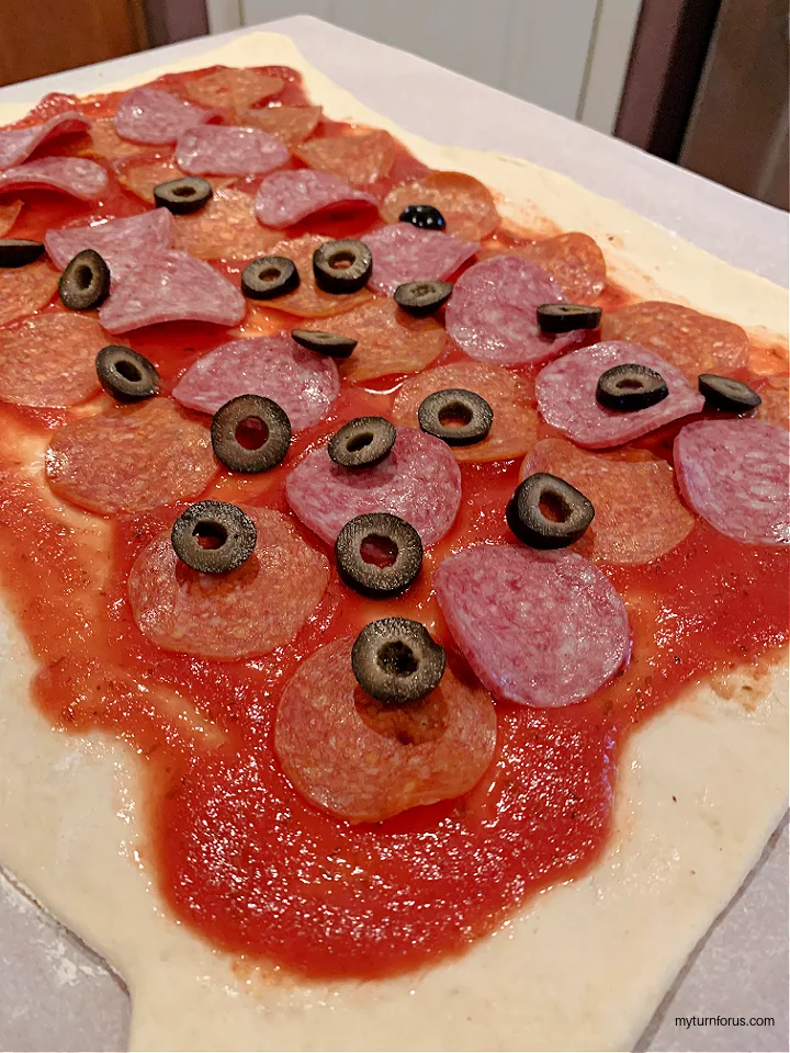 pizza toppings on Stromboli dough