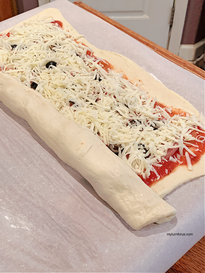 rolling up the stromboli