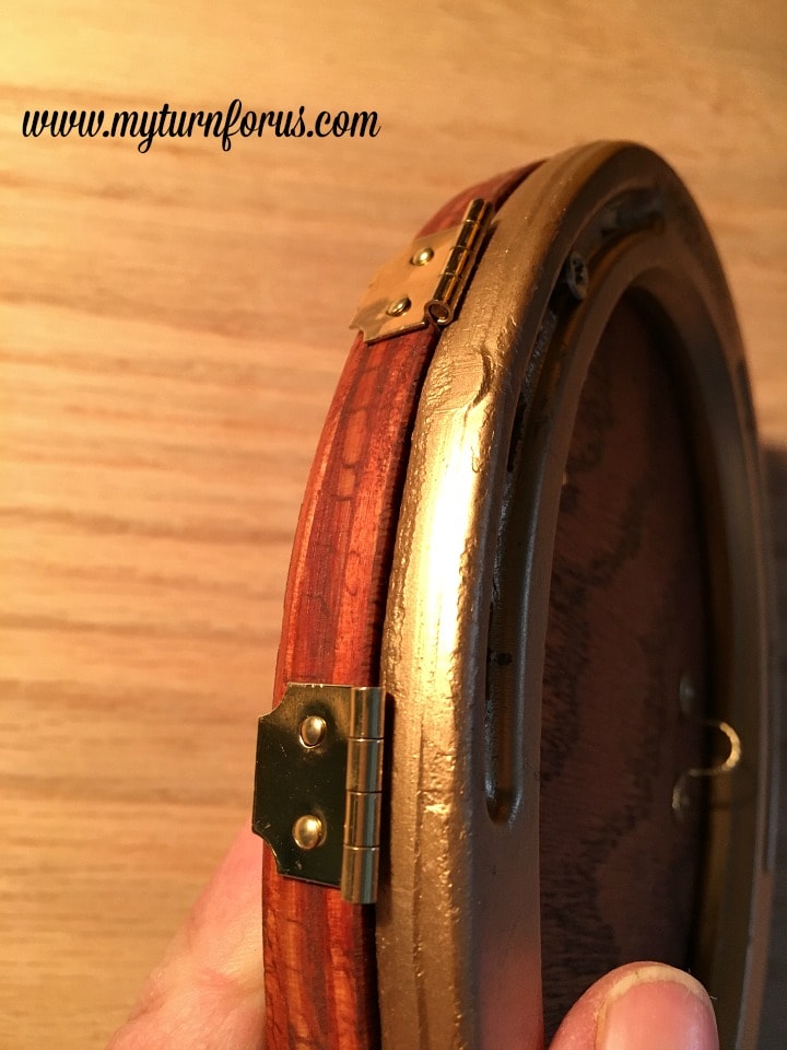 Horseshoe Fairy Door for the most magical fairy garden! https://www.myturnforus.com/2016/03/horseshoe-fairy-door.html Side view of the fairy door showing the smaller sections of the decorative hasps folded around the plywood edge and secured with nails.