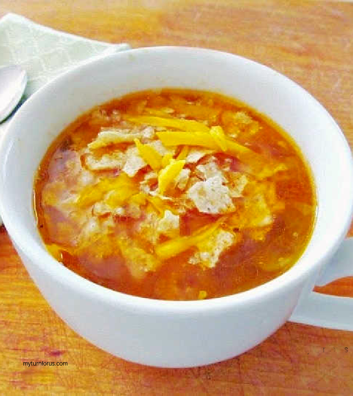 bowl of caldo con pollo spicy Mexican soup