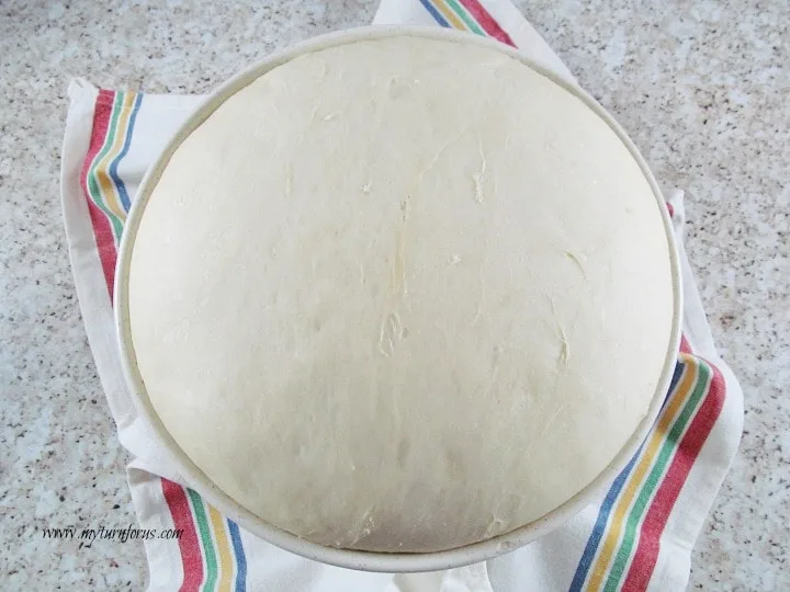 dough rising in a bowl