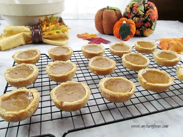 mini pumpkin pies in a muffin tin