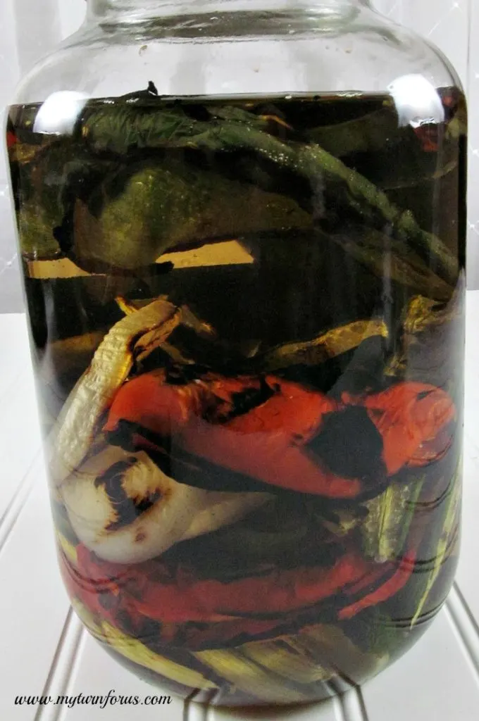 Grilled peppers and onions in vodka for spicy infused vodka