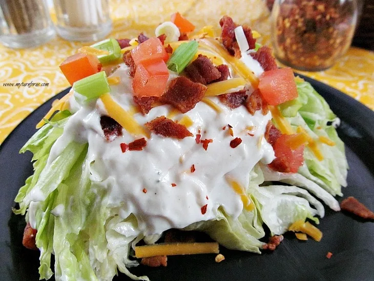 creamy salad dressing, wedge salad recipe, wedge of lettuce topping with bacon bits, tomatoes, green onions and cheese