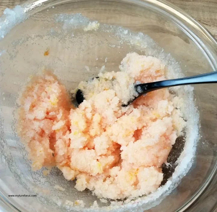 mixing orange zest with coconut oil and sugar