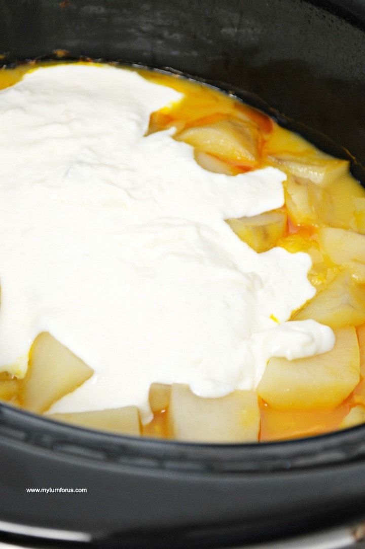 adding half and half mixture to crockpot potato soup