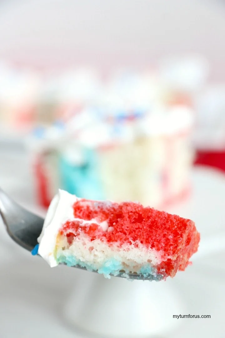 a bite of Red White and Blue Poke Cake