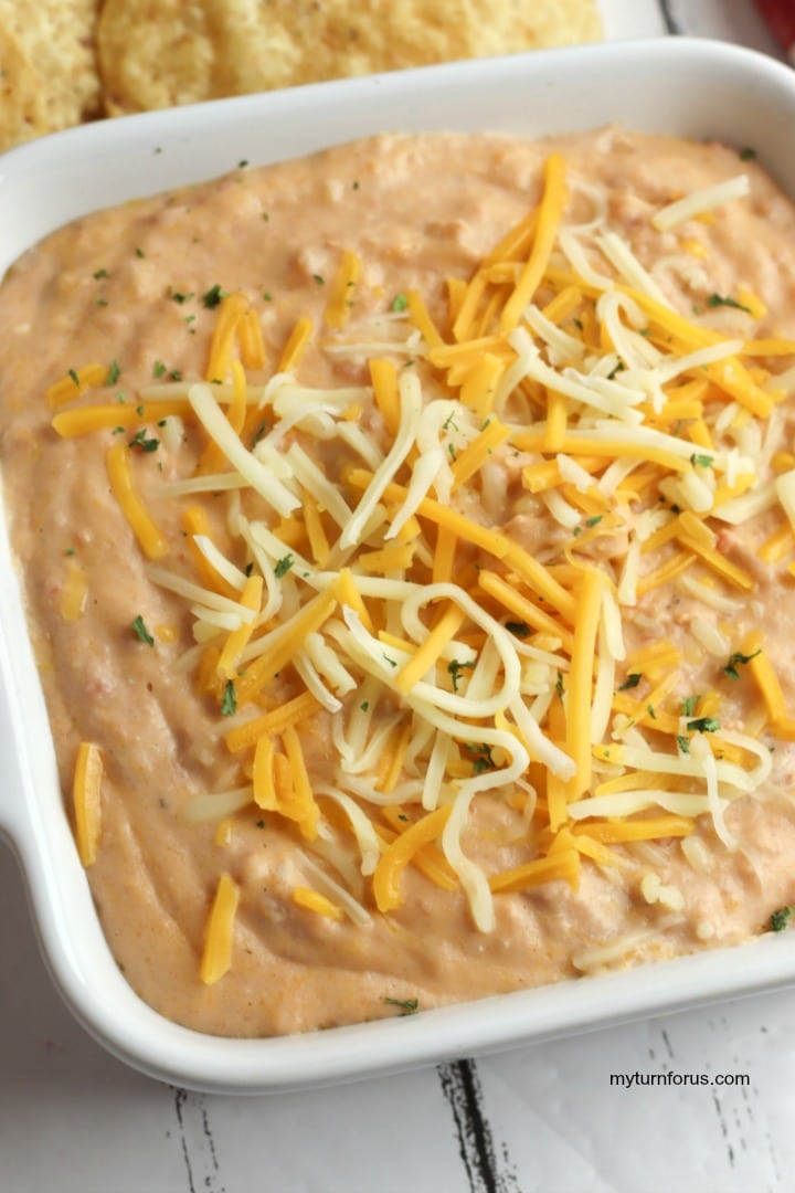 cheesy rotel bean dip, Pan of hot cheesy rotel bean dip topped with cheese