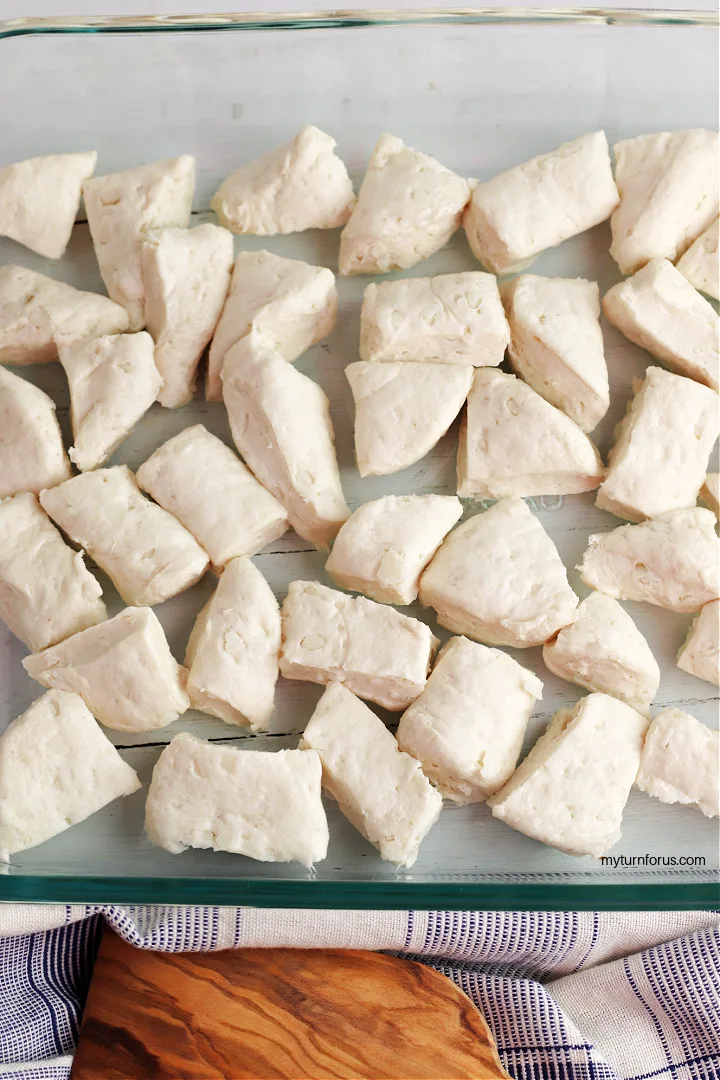 cut up refrigerated biscuits in a pan