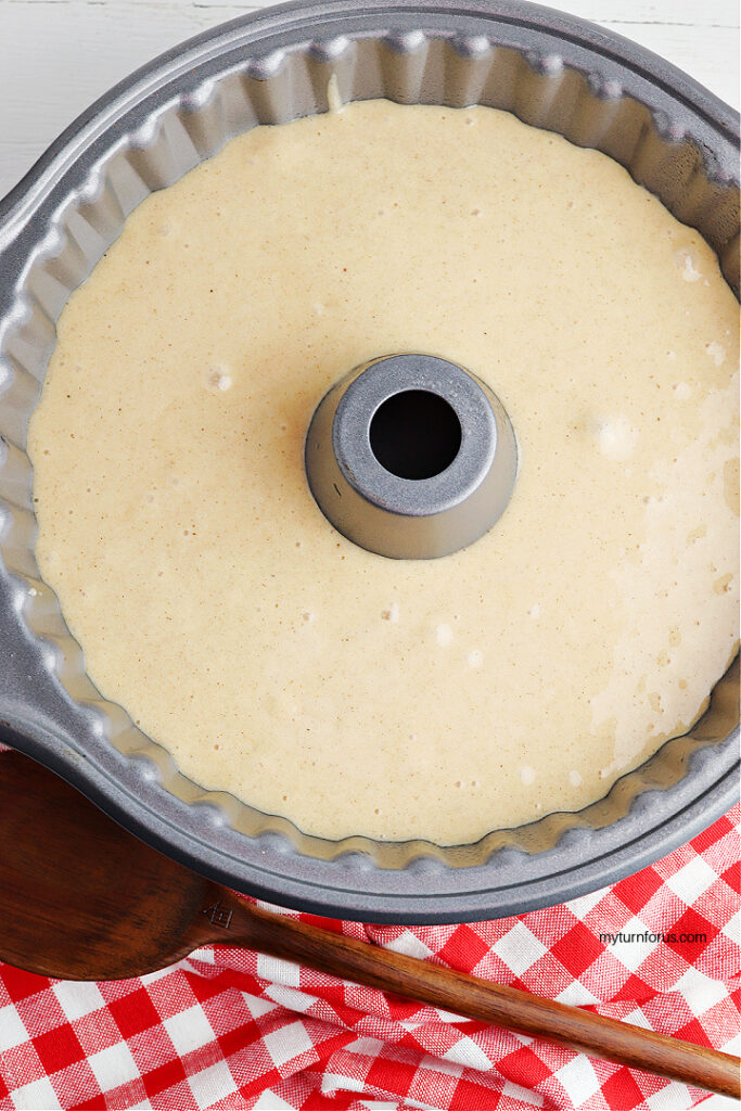 spice cake mix in a bundt pan Cake batter poured over apple pie filling in a Bundt pan before baking.