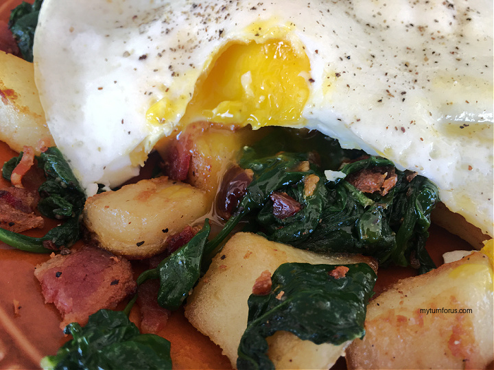 Potato hash with spinach and eggs