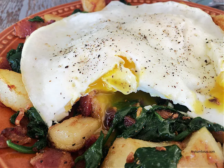 fried eggs with spinach, bacon potato hash