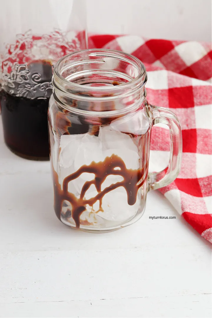 glass filled with ice and drizzled with chocolate 