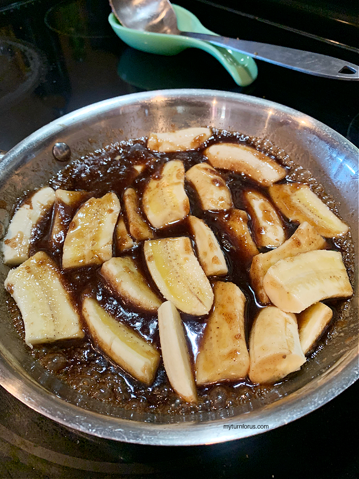 making Banana Flambé with rum