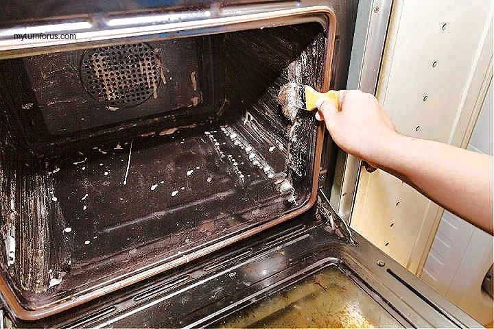 painting baking soda and vinegar on oven