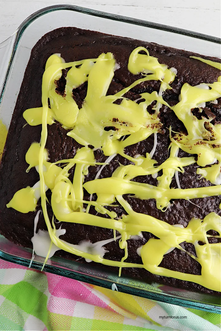 yellow creme filling on the chocolate poke cake