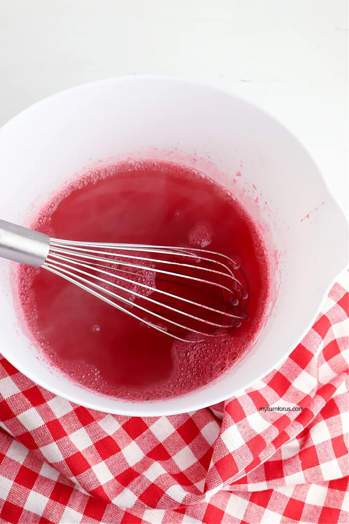 red jello in white bowl