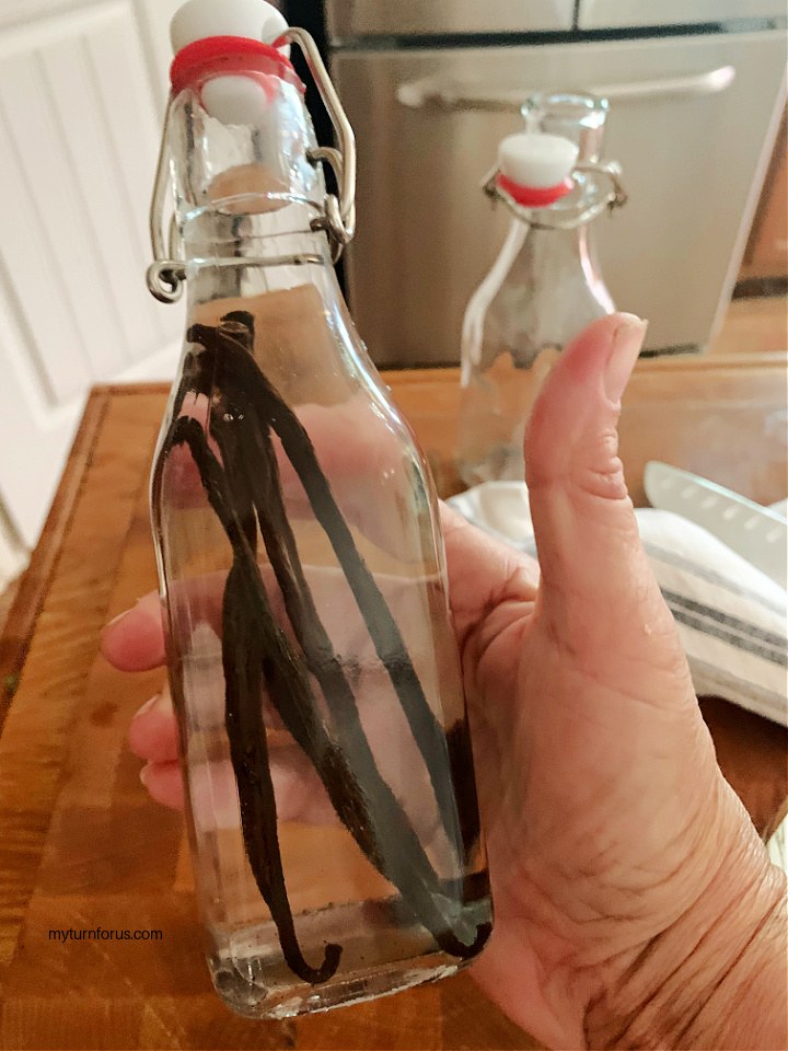 vodka and vanilla beans in stoppered bottle