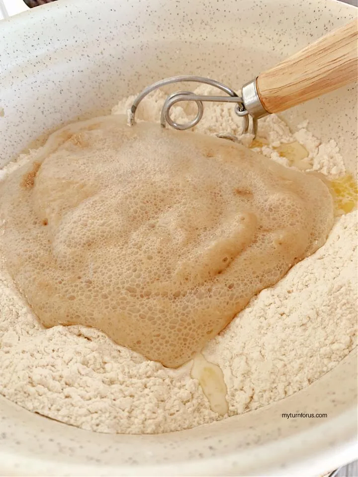 Mixing old fashioned soft and buttery yeast rolls