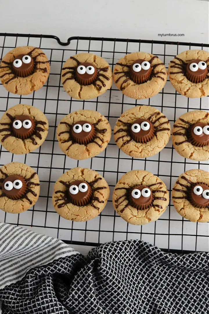 peanut butter spider cookies on cooling rack