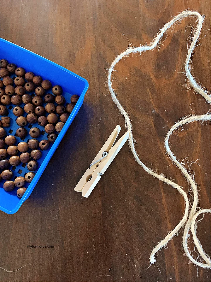 wooden beads, jute twine and clothes pin