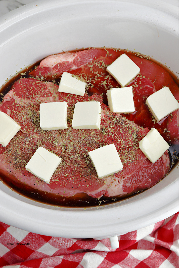 beef roast with butter in slow cooker