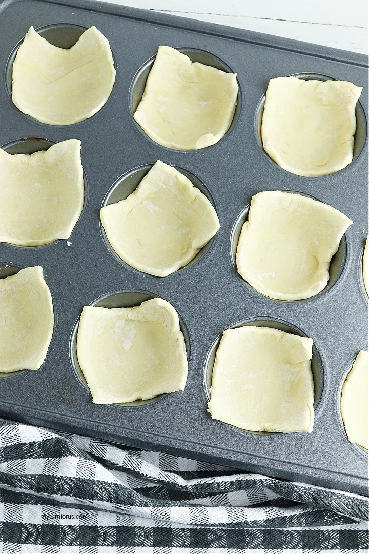 puff pastry rectangles in muffin tin
