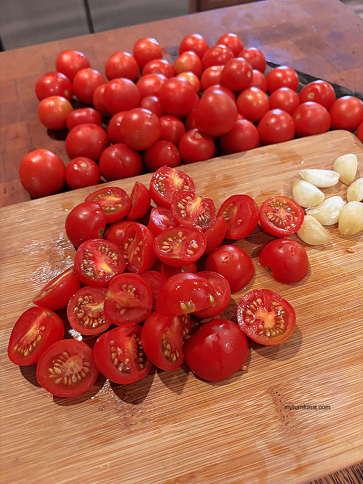 cutting tomatoes for oven roasted tomatoes